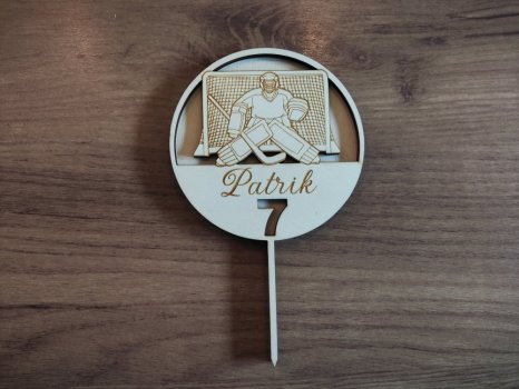 Zápich na dort s hokejovým brankářem a brankou barevný